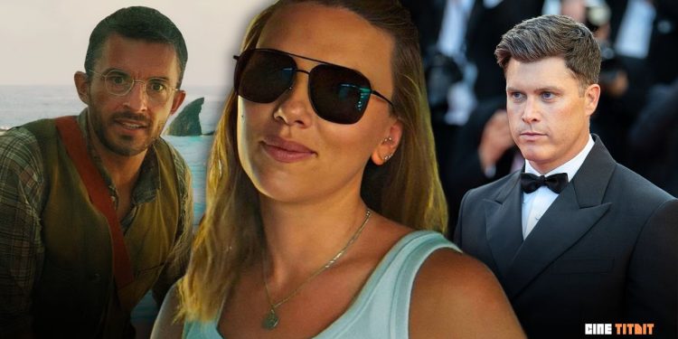 Colin Jost smiles on red carpet while addressing Scarlett Johansson’s friendly kiss with Jonathan Bailey during 'Jurassic World Rebirth' premiere events.
