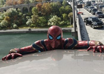 Tom Holland's Spider-Man suit featuring raised webbing, reminiscent of Tobey Maguire's classic design from Sam Raimi's trilogy.
