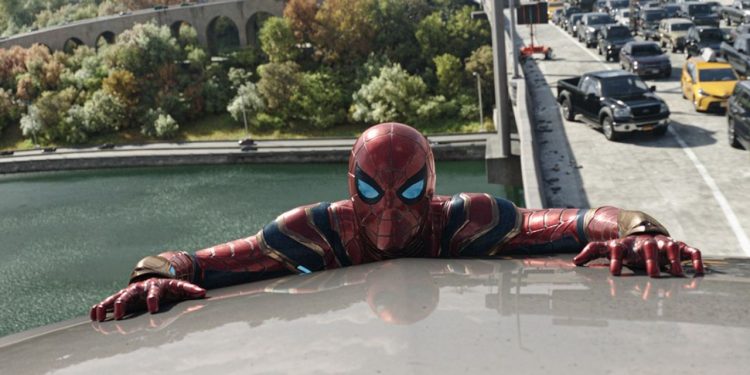 Tom Holland's Spider-Man suit featuring raised webbing, reminiscent of Tobey Maguire's classic design from Sam Raimi's trilogy.