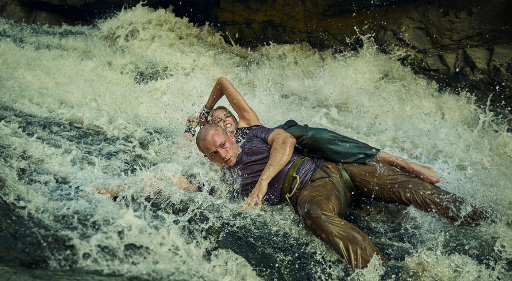 Taron Egerton as Ben and Charlize Theron as Sasha in 'Apex'