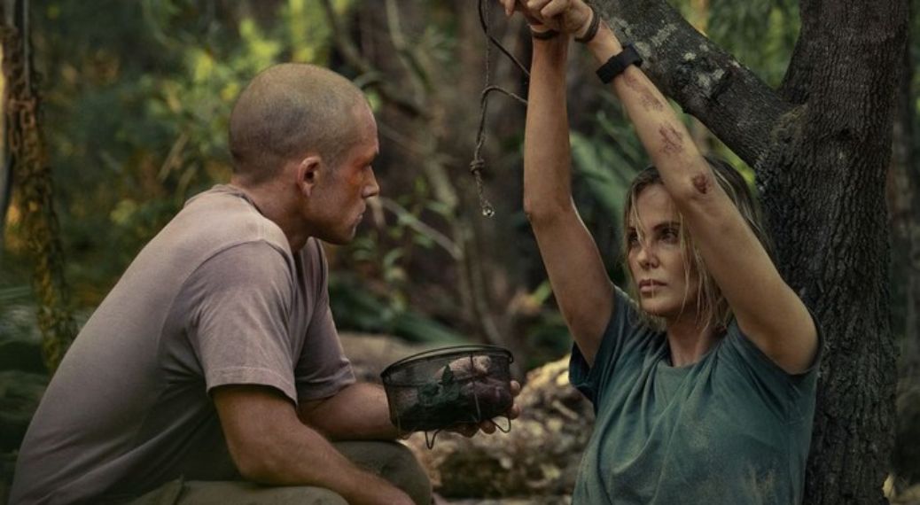 Taron Egerton as Ben and Charlize Theron as Sasha in 'Apex'